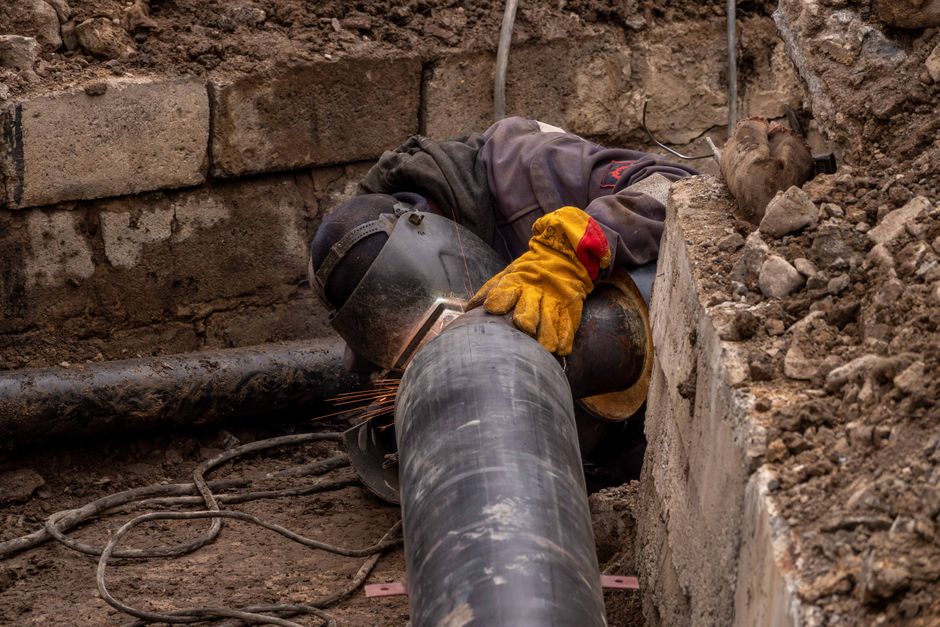 Close-up of a drainage pipe being repaired using relining method outdoors
